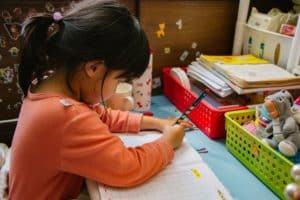 Child learning on a table