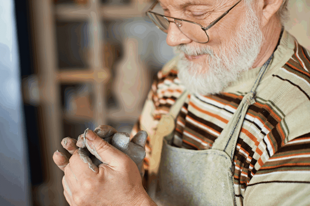 Man working with clay
